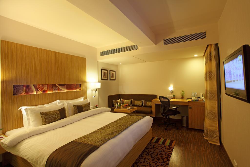 Comfort Inn Legacy Rajkot Rum bild